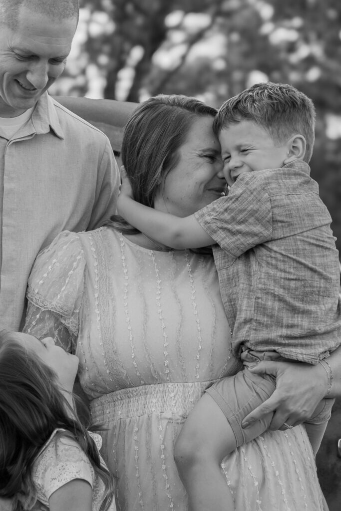 Family loving on eachother with MelMarie Photography during a family photography session in West Bend Wisconsin