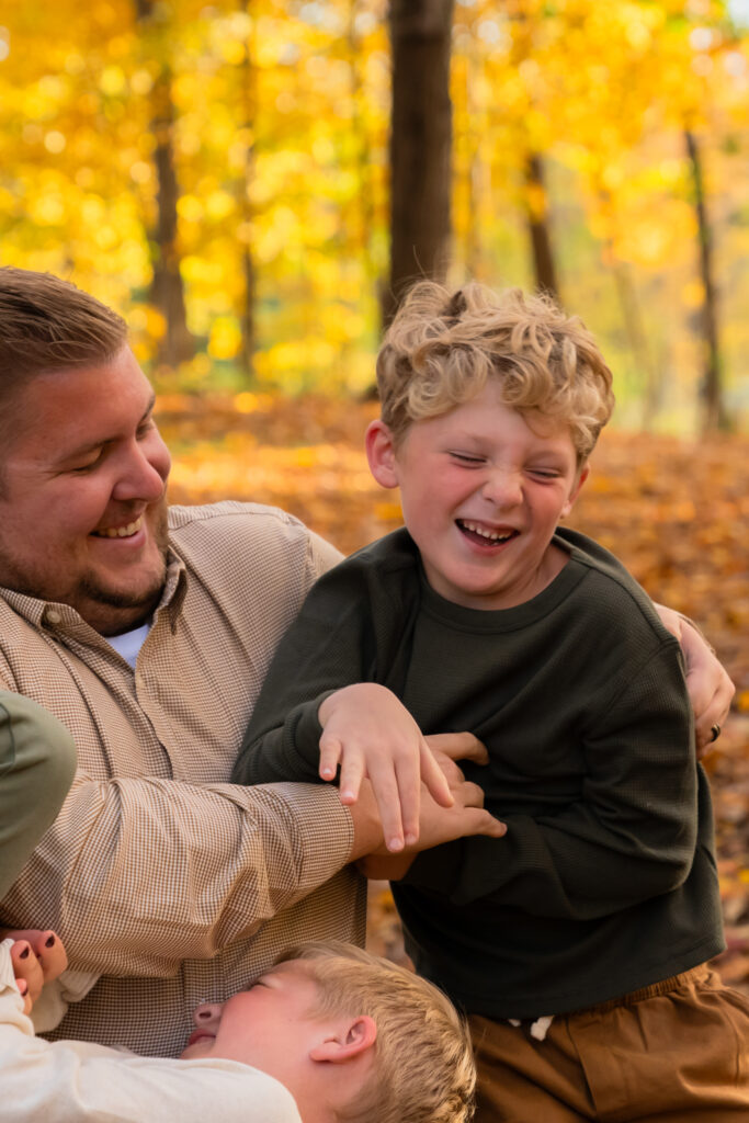 Fall family photos at Menomonee Park in Menomonee Falls Wisconsin with vibrant autumn colors