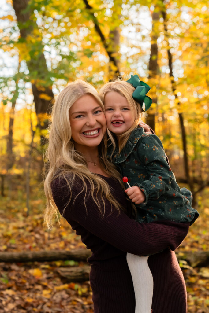 Fall family photos at Menomonee Park in Menomonee Falls Wisconsin with vibrant autumn colors
