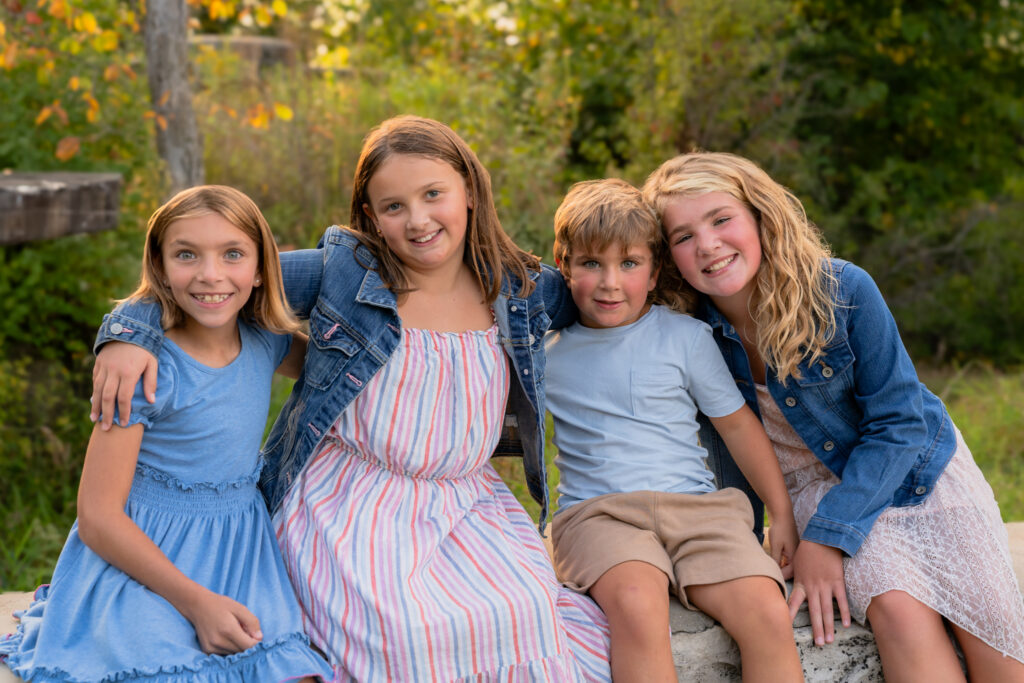 Family photography at Menomonee Park featuring natural Lannon stone quarry walls in Southeast Wisconsin