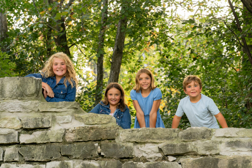 Family photography at Menomonee Park featuring natural Lannon stone quarry walls in Southeast Wisconsin