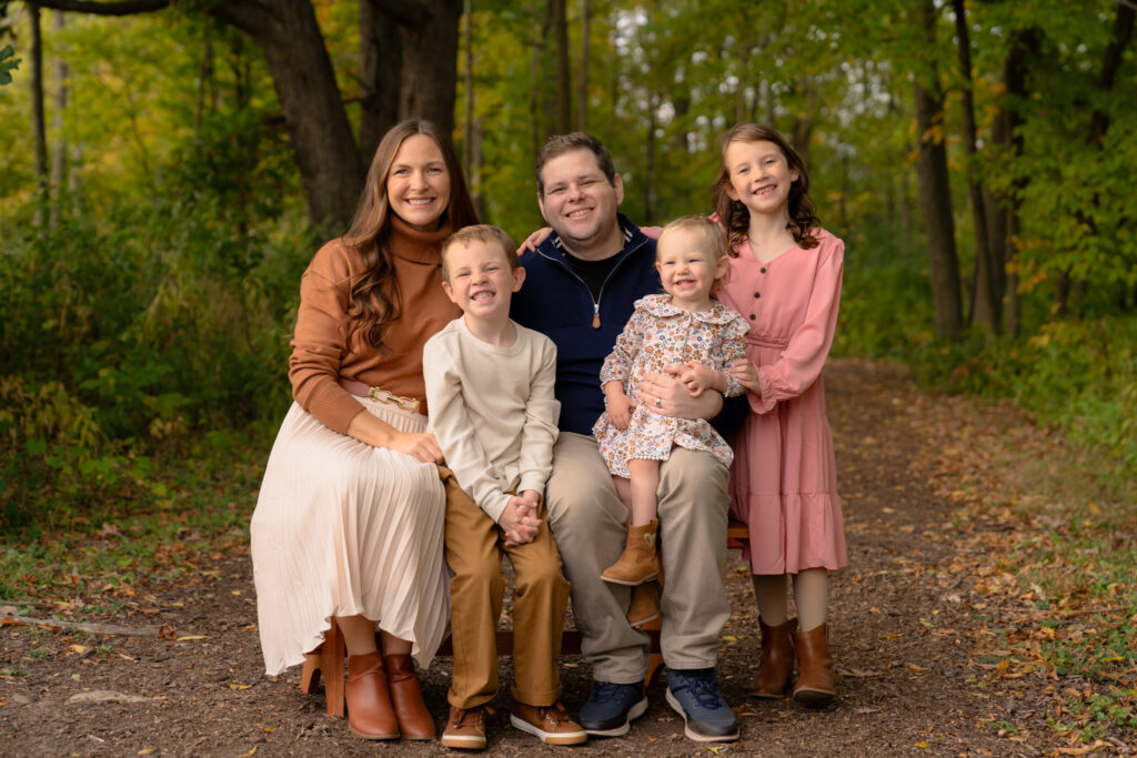 Fall family photography on wooded trail at Menomonee Park in Menomonee Falls Wisconsin