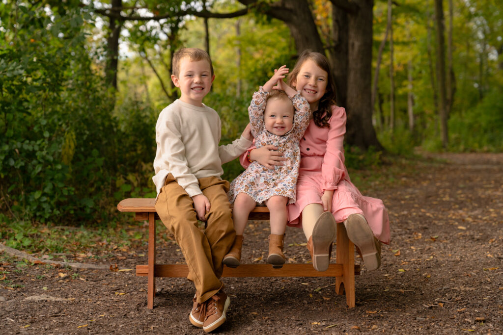 Fall family photography on wooded trail at Menomonee Park in Menomonee Falls Wisconsin