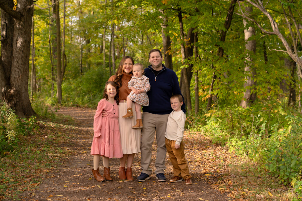Fall family photography on wooded trail at Menomonee Park in Menomonee Falls Wisconsin