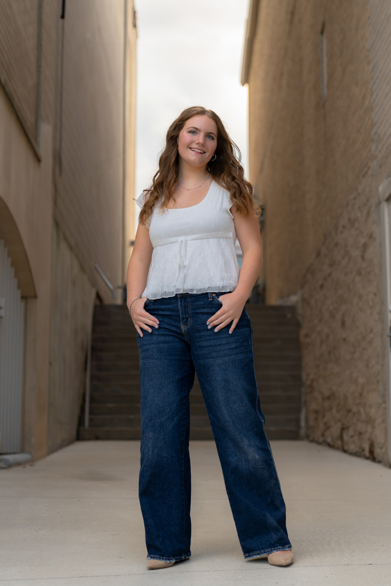 Confident young woman posing for camera