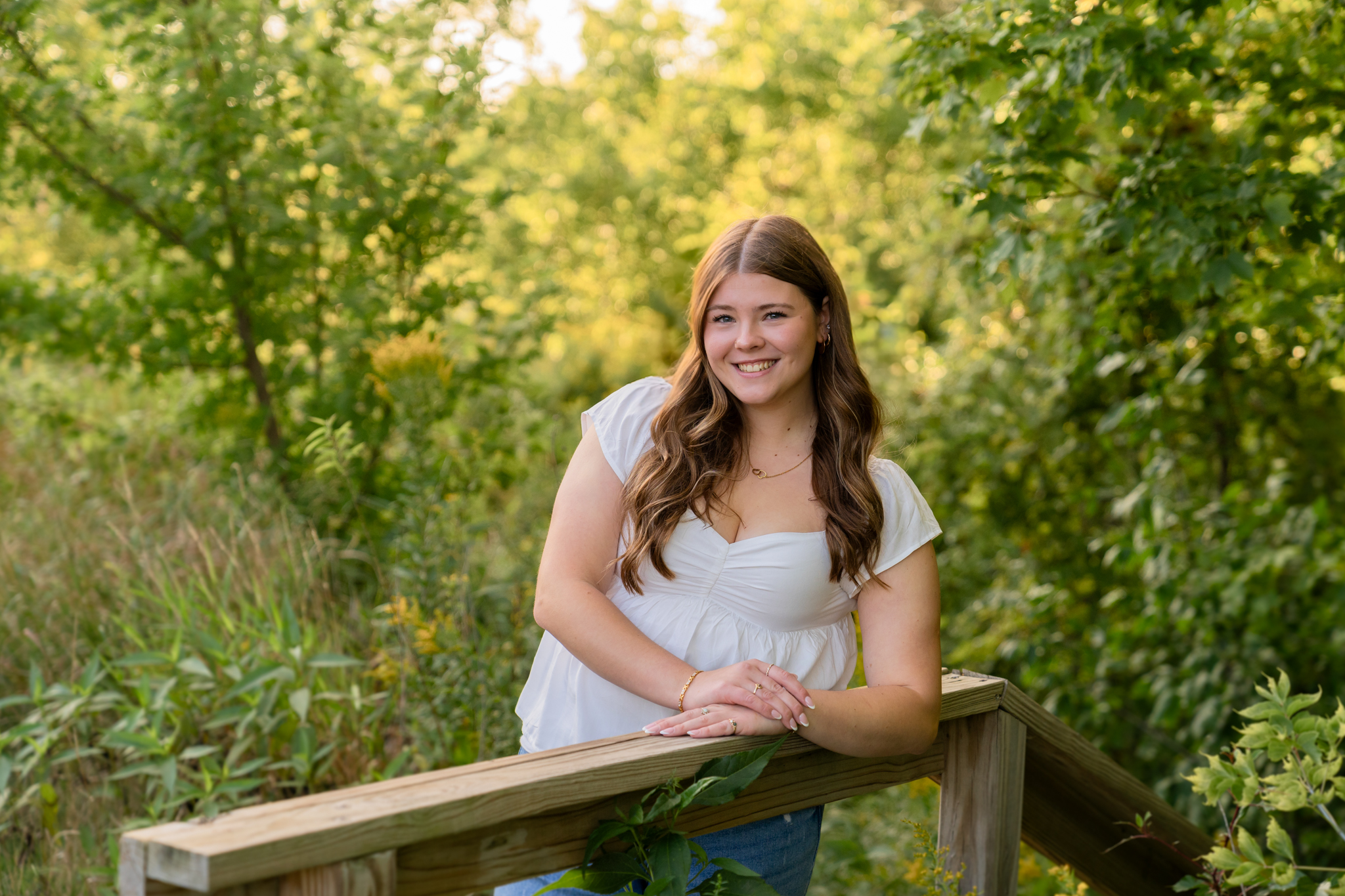senior girl smiling at camera at park in West Bend