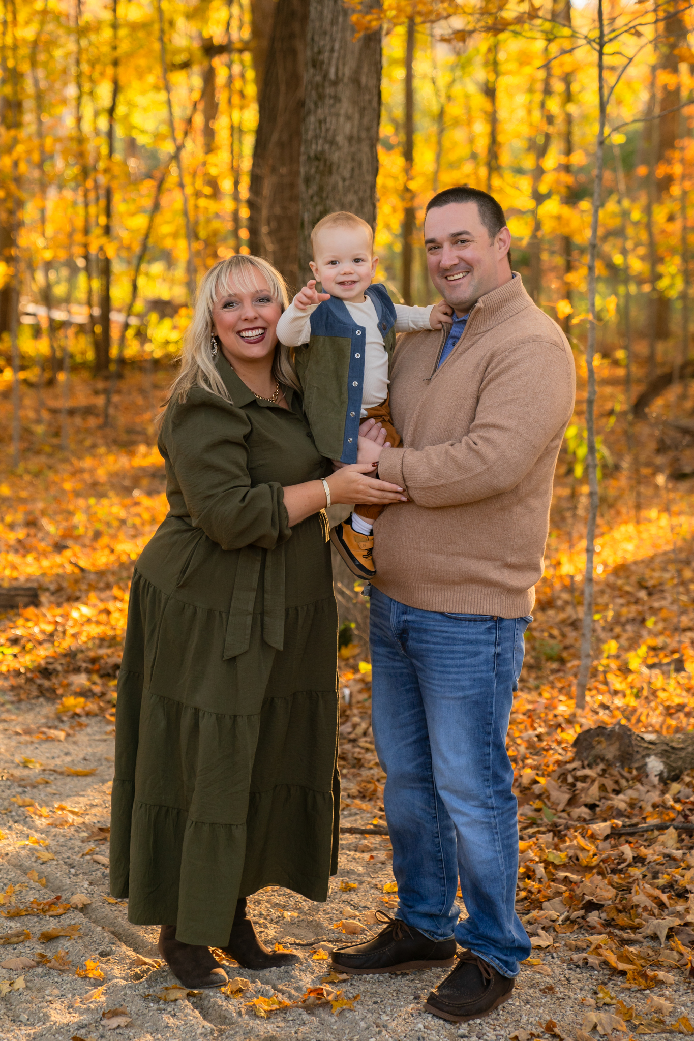 Relaxed family smiling for fall photos