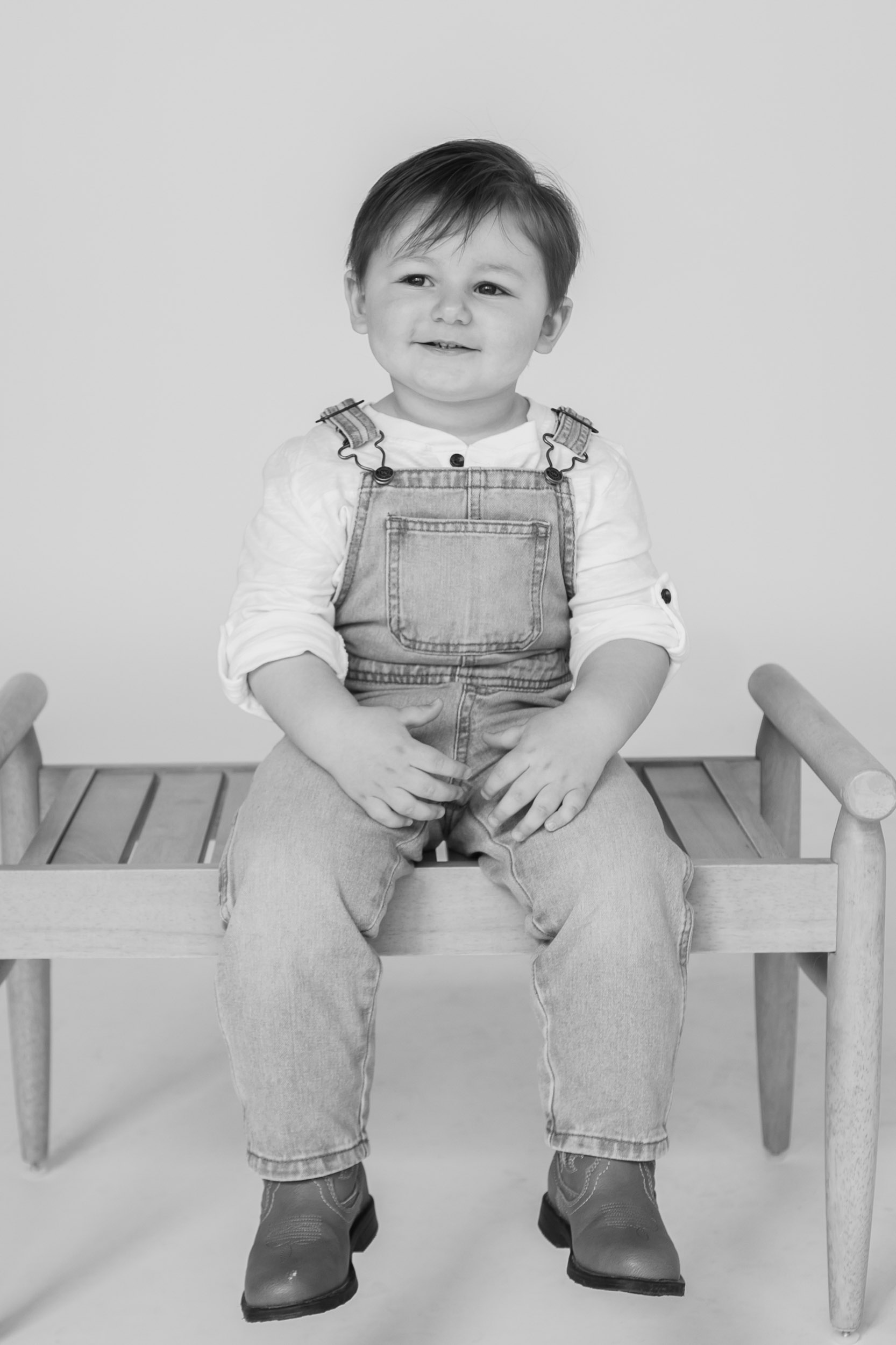 Toddler smiling during milestone family photos Milwaukee WI indoor session