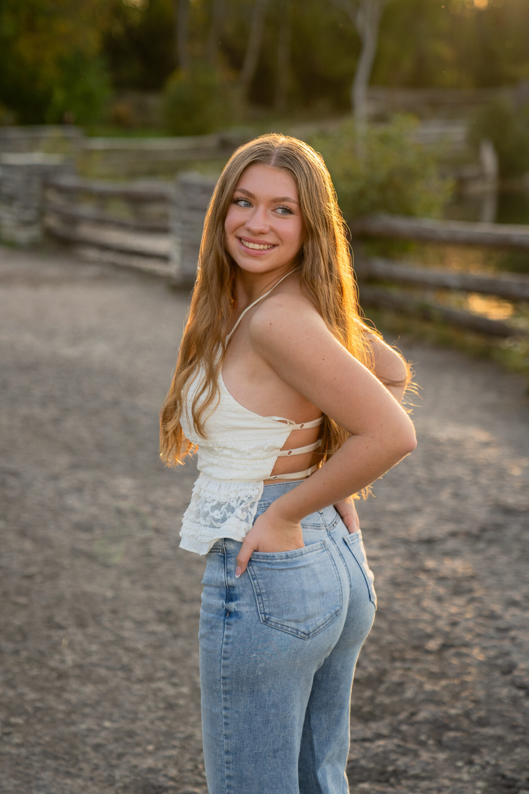 Hamilton high school Sussex Wisconsin senior girl posing for a senior session at Menomonee Park