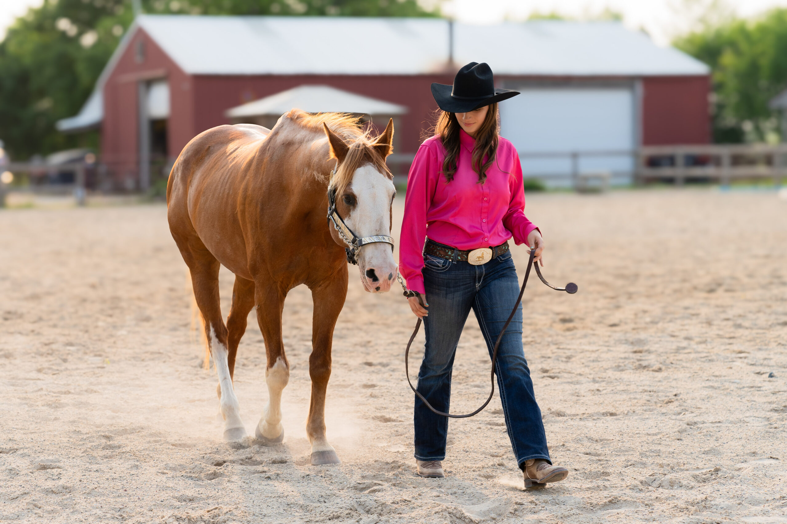 West Bend Wisconsin high school senior walking with her horse during a photography session