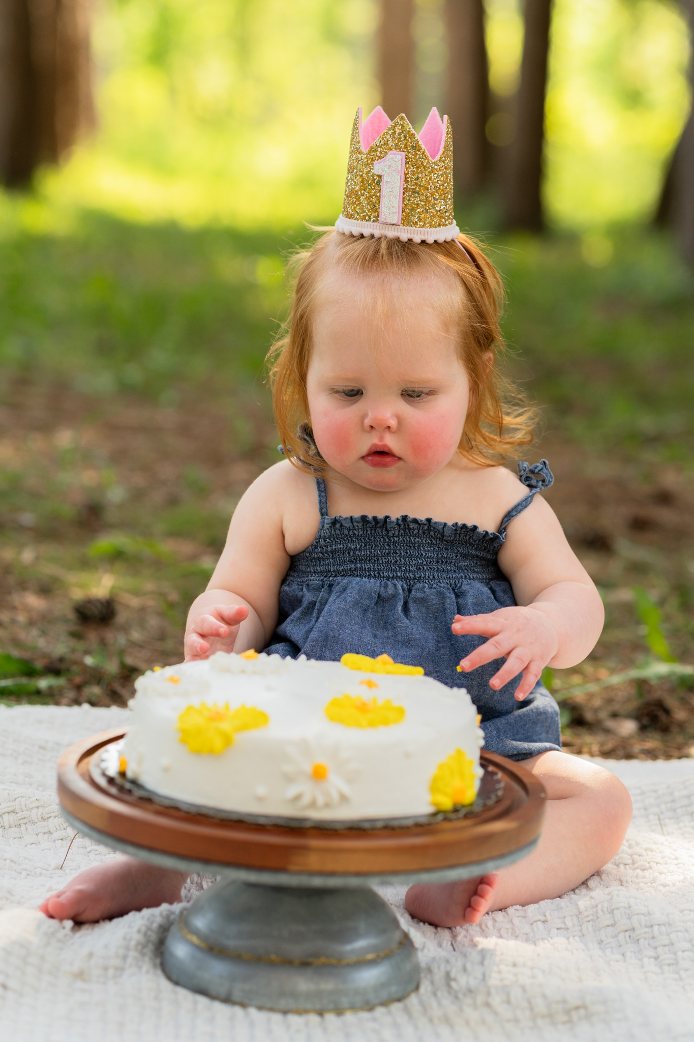 One-year-old enjoying a cake smash session in West Bend, Wisconsin