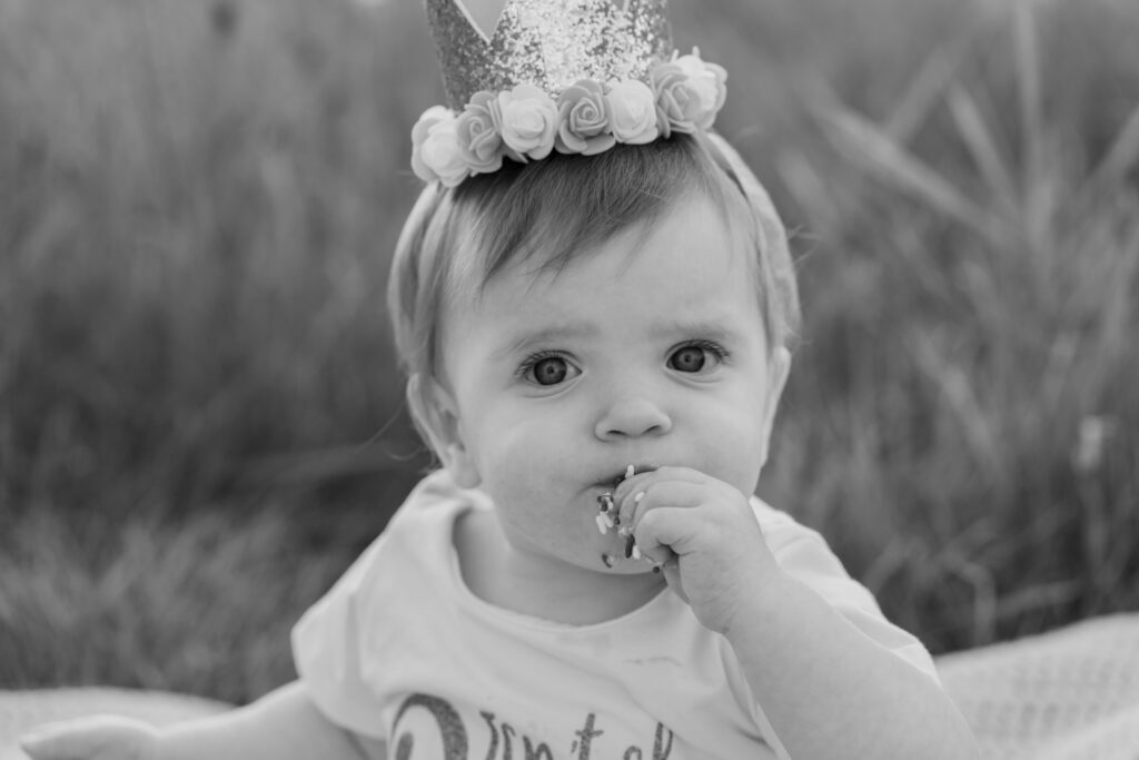 Close-up of a baby’s expressions during a one-year milestone session