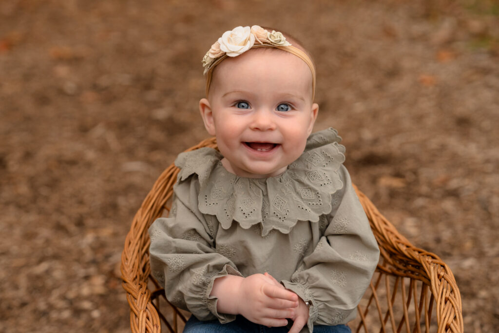 Little girl laughing during family photo session in Menomonee Falls WI