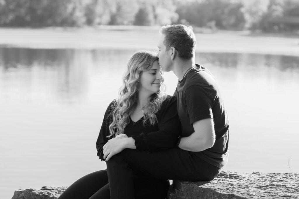 Boyfriend and girlfriend sitting on a rock overlooking a quarry in Menomonee Falls