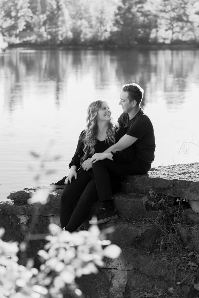 Man and woman smiling at each other during couples photography session in Menomonee falls wisconsin