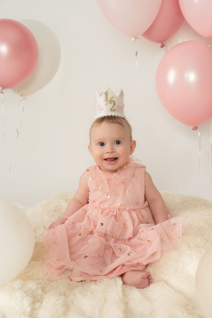 studio milestone session with six month old and balloons in cedarburg wisconsin