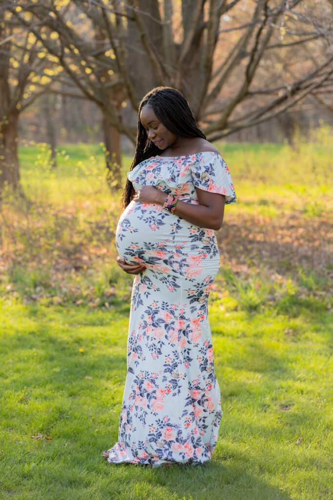 Maternity photography session in Milwaukee Wisconsin while mother holds her belly 