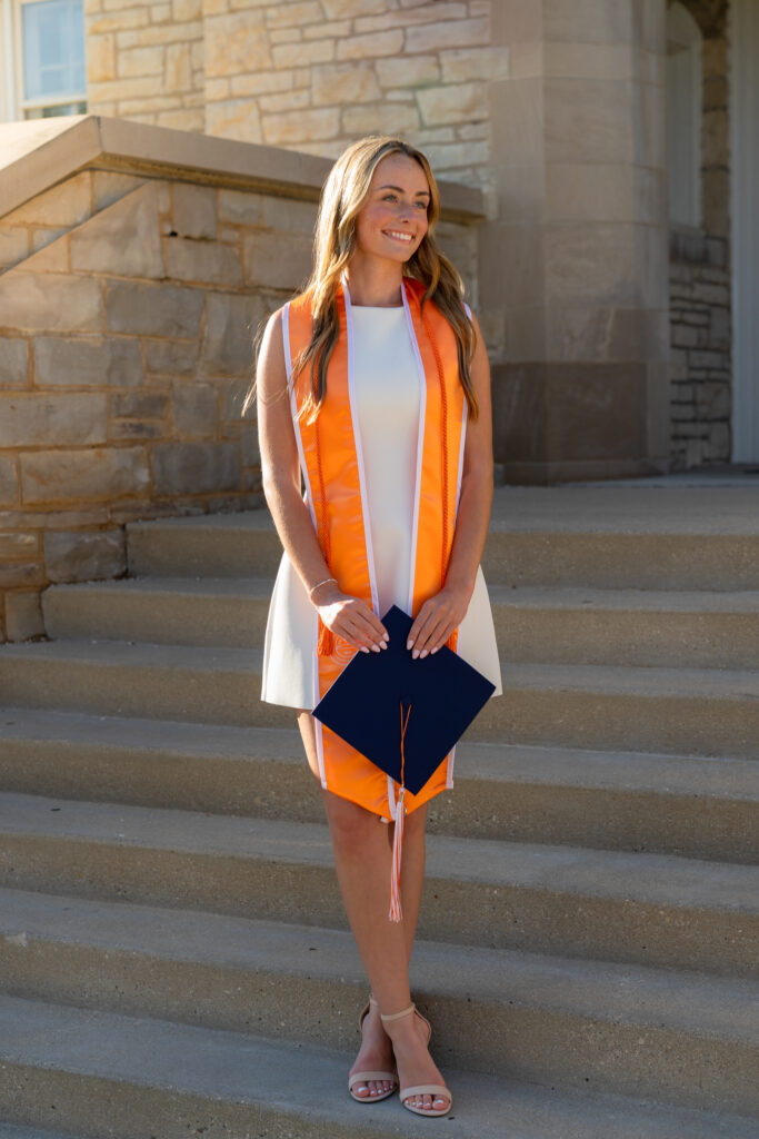 Senior posing near Carroll University buildings in Waukesha Wisconsin