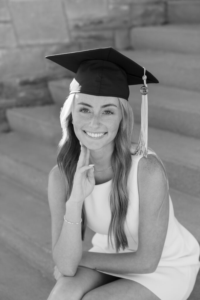 Senior sitting on Carroll University campus stairs Waukesha WI