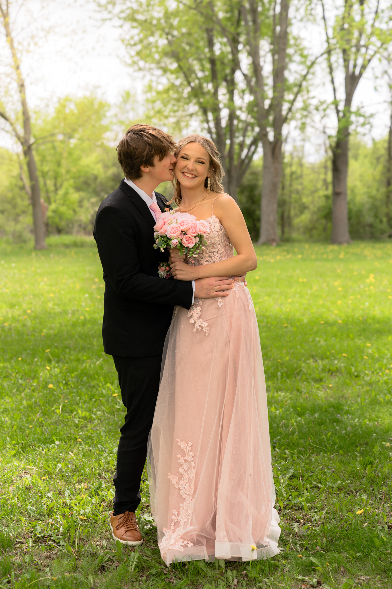 Prom couple posing together during their photography session with MelMarie Photography