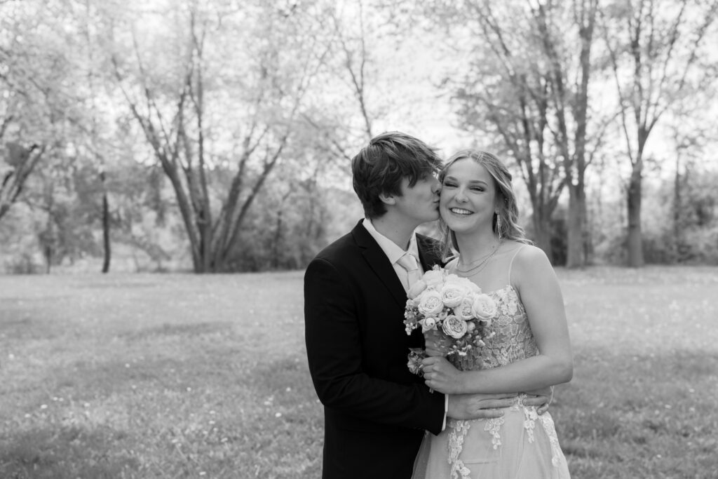Prom couple posing at Pike Lake in Kettle Moraine State Park spring Wisconsin
